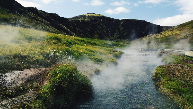 Hiking in Reykjadalur will reward you with free hot springs in Iceland